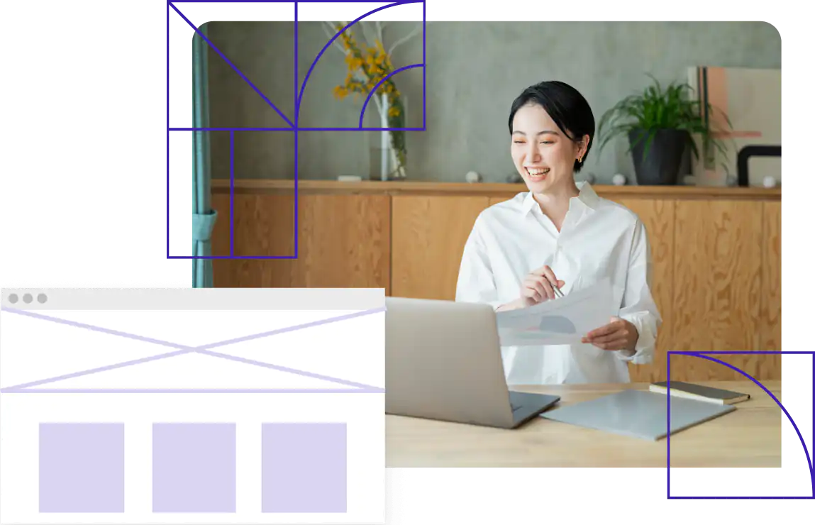 Woman smiles happily at laptop